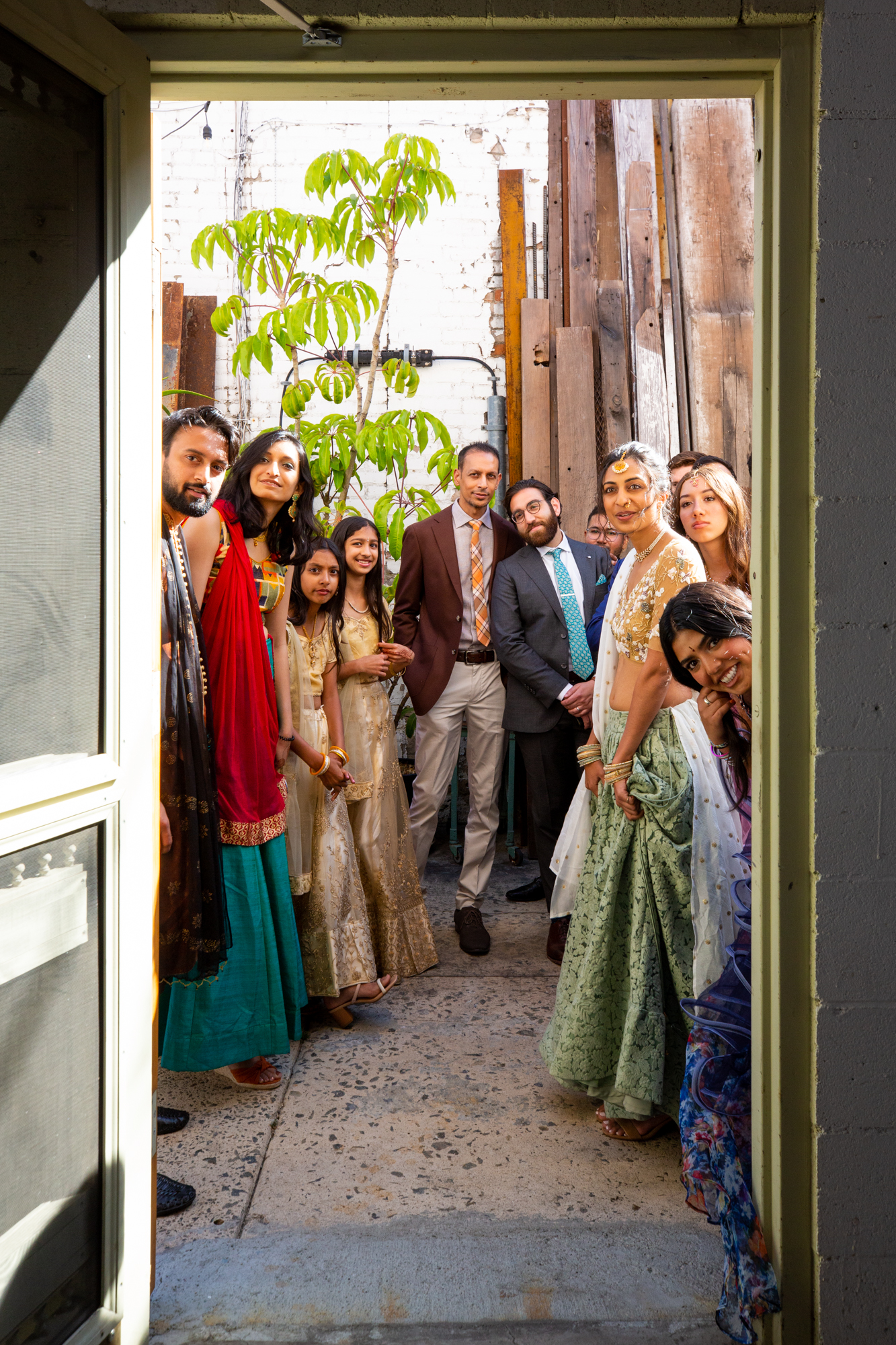 wedding guests peek out before baraat Los Angeles
