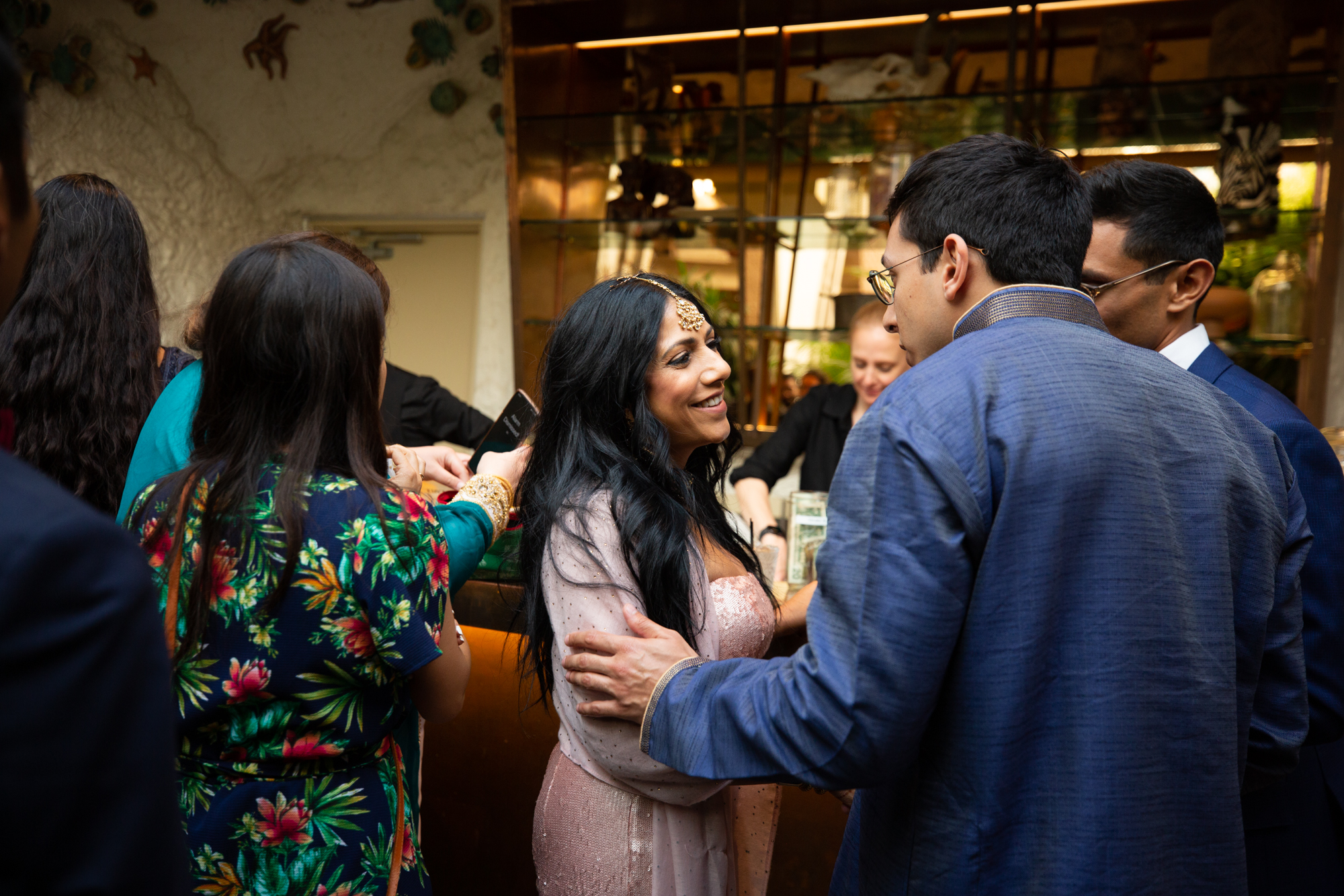 wedding guests greet each other at bar in downtown los angeles