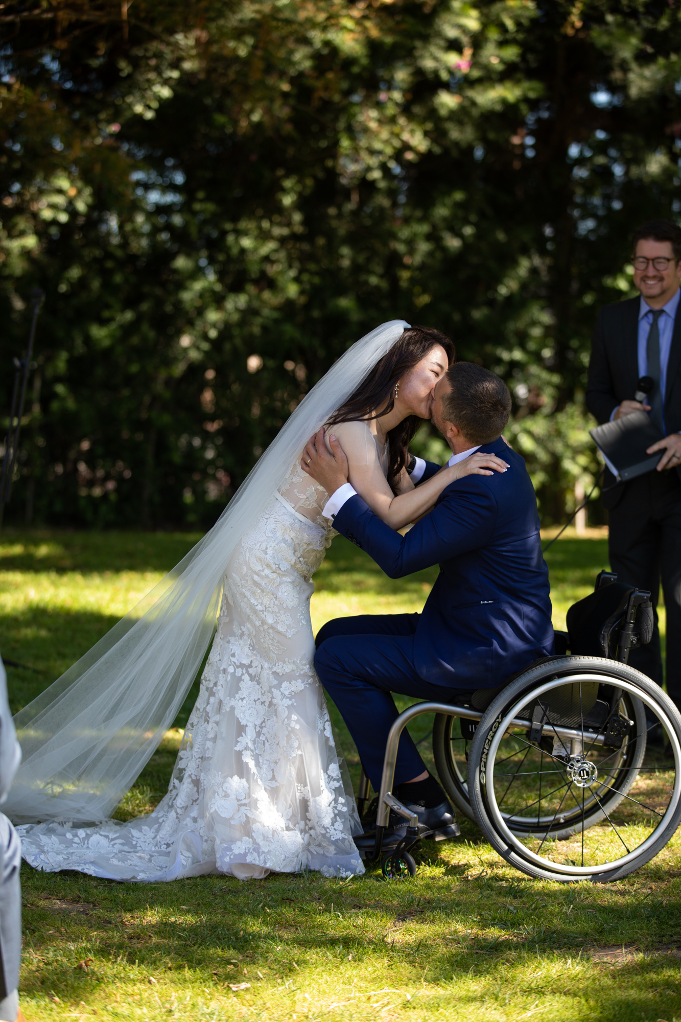 wheelchair groom bride kiss wedding