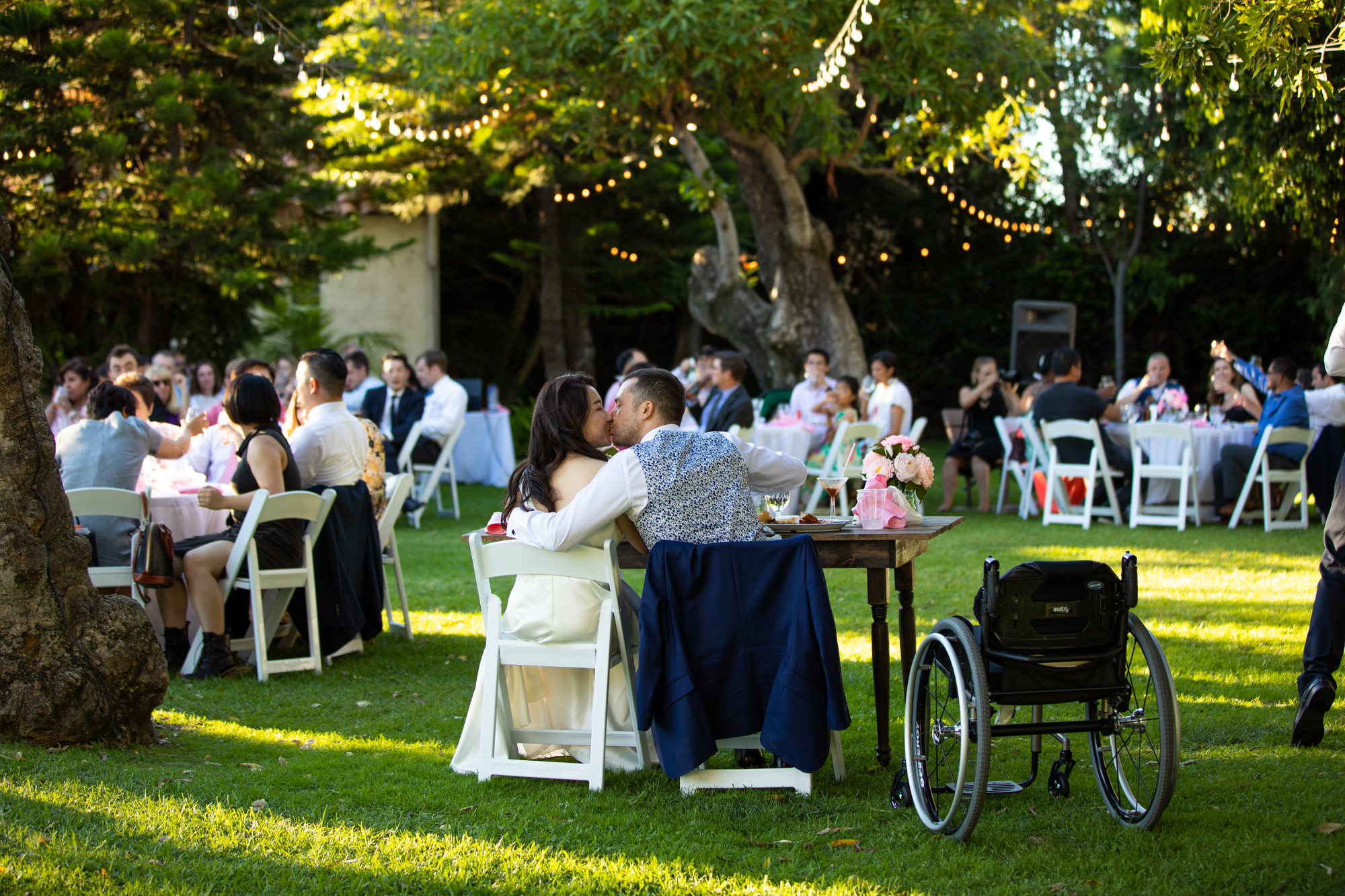 bride and groom kiss wheelchair the griffith house