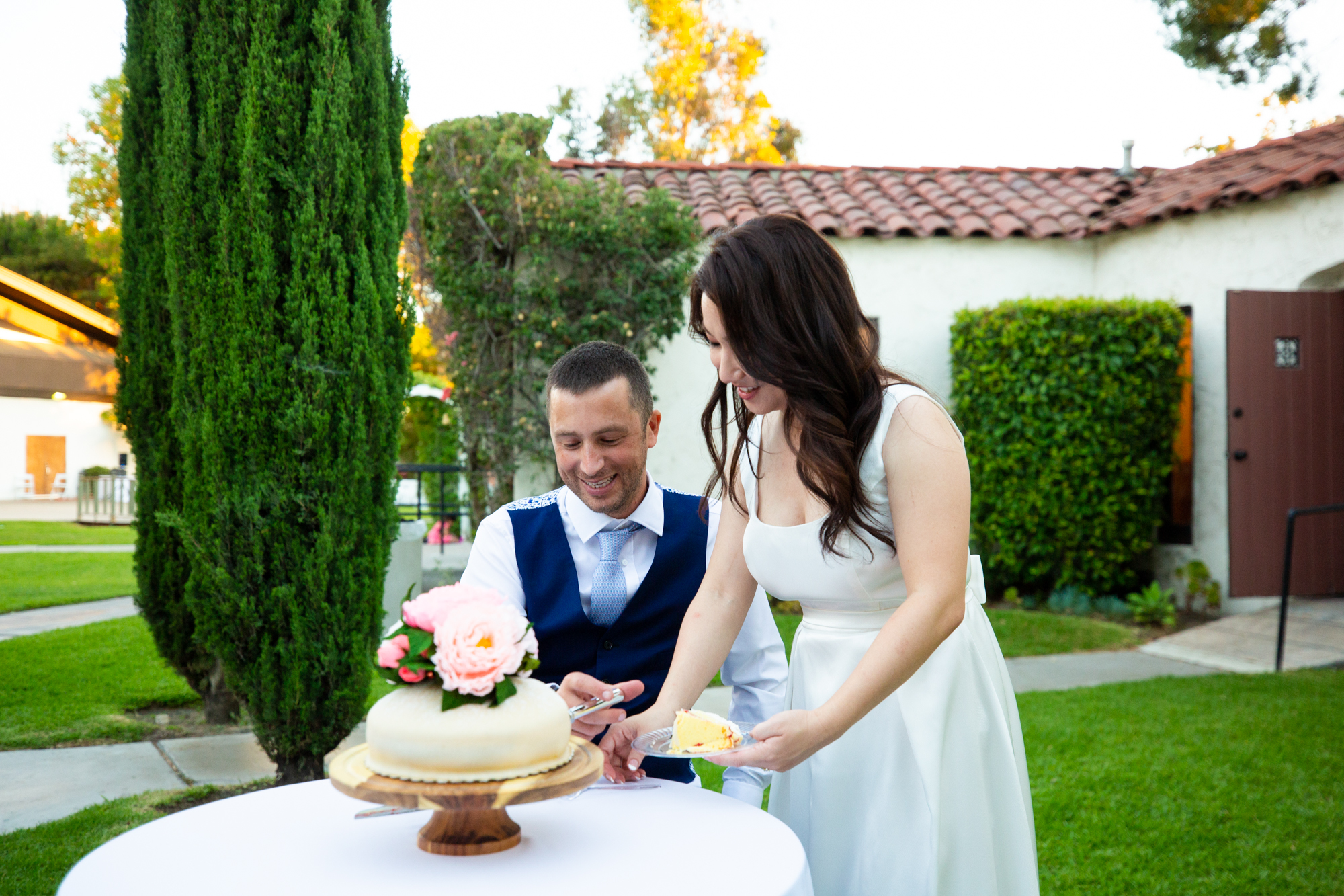 bride and groom cut cake in anaheim