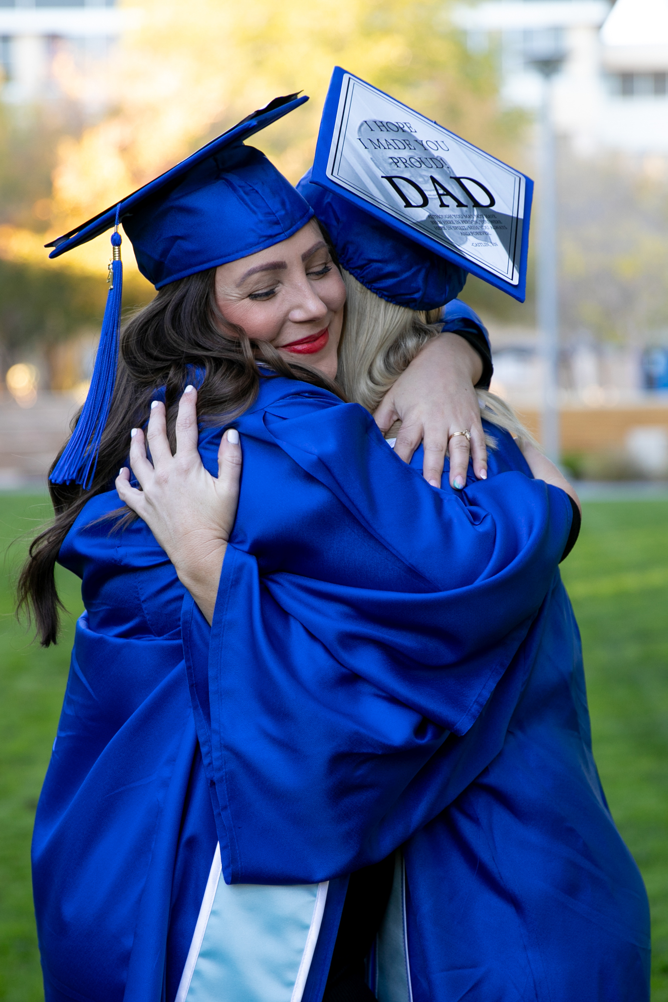 college graduates hug at santa monica college