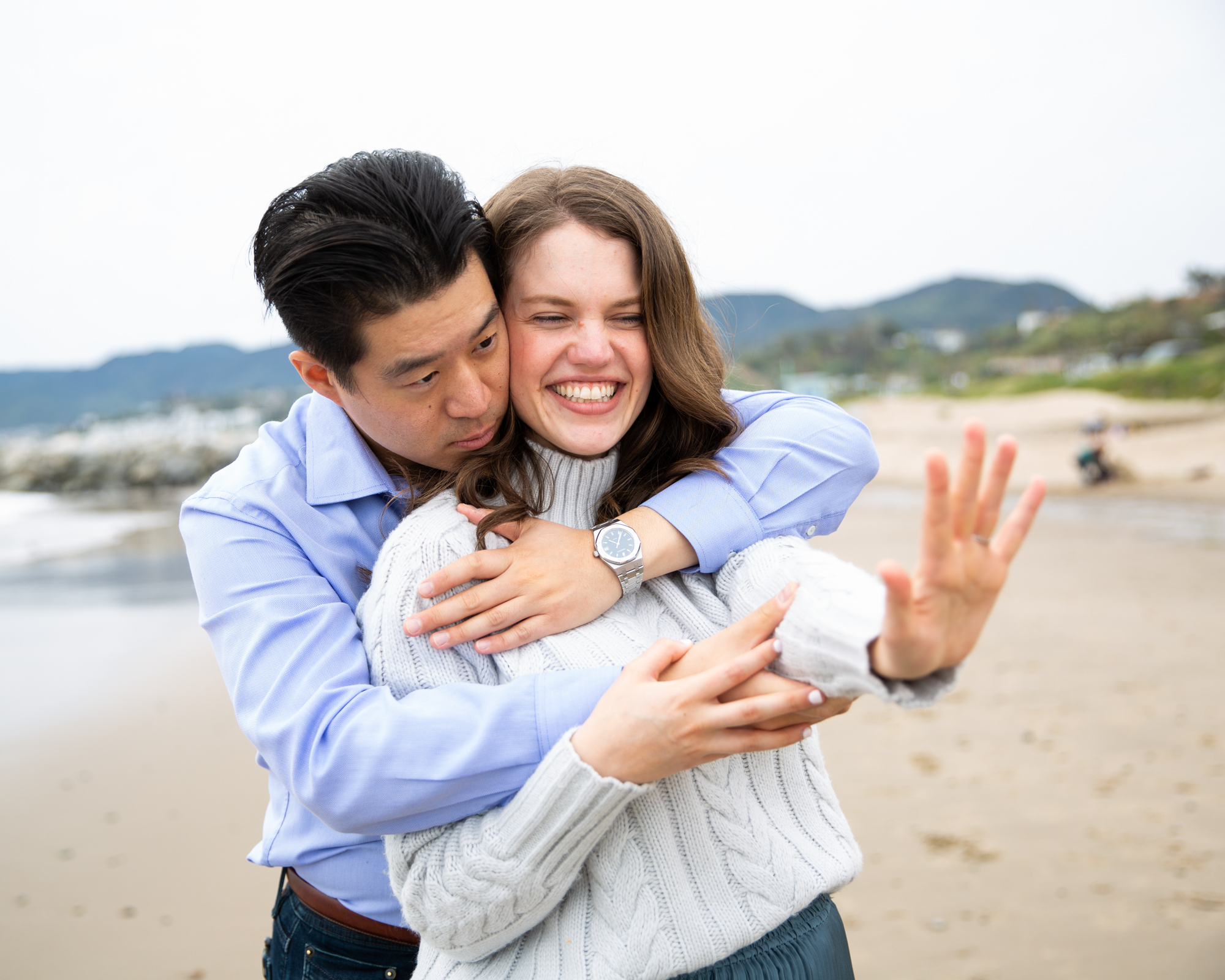 newly engaged couple celebrates at will rogers state beach