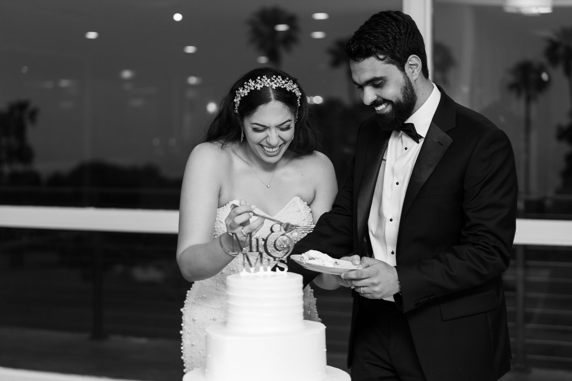 bride and groom cut cake in vista ballroom Los Verdes Golf Course