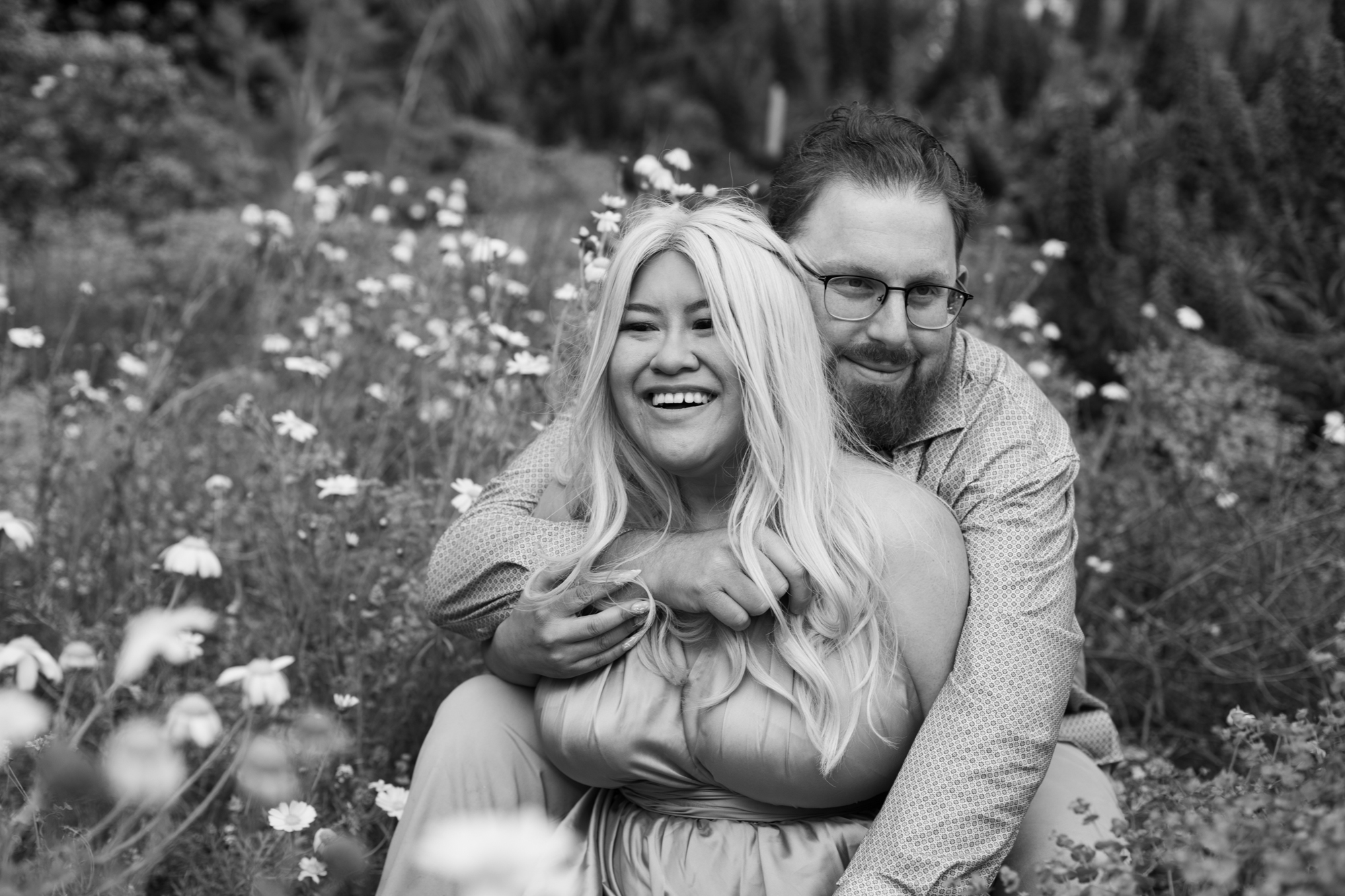 black and white photo couple in flowers point dume