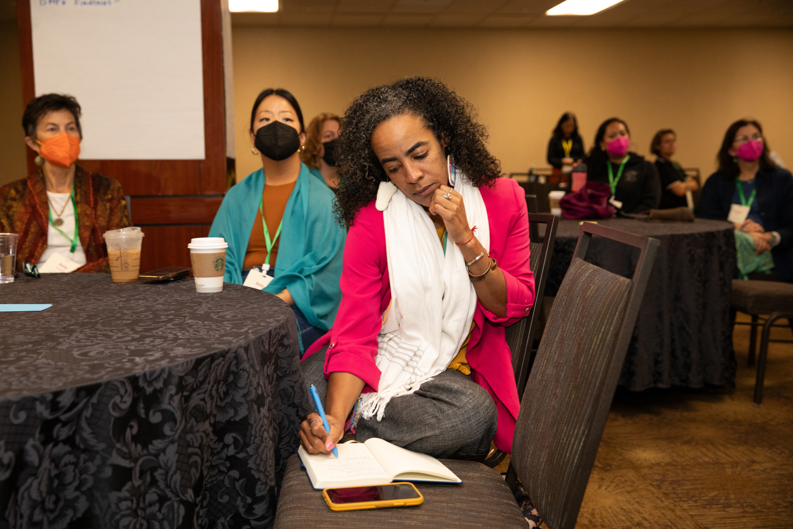 woman taking notes breakout session conference los angeles